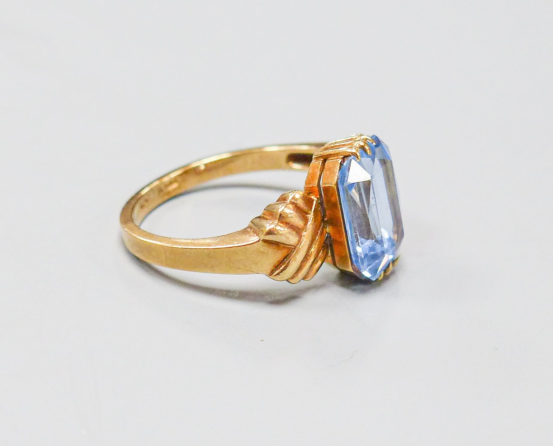 A 9ct and blue paste set dress ring, size O, gross weight 3.8 grams.